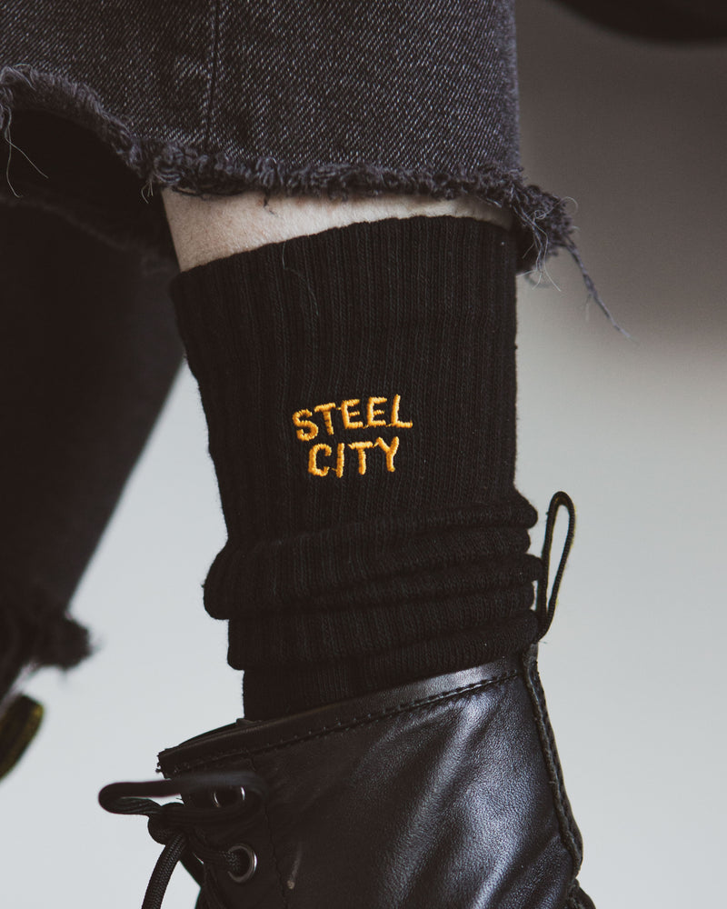 Gold Steel City Logo Detail on Black Sock